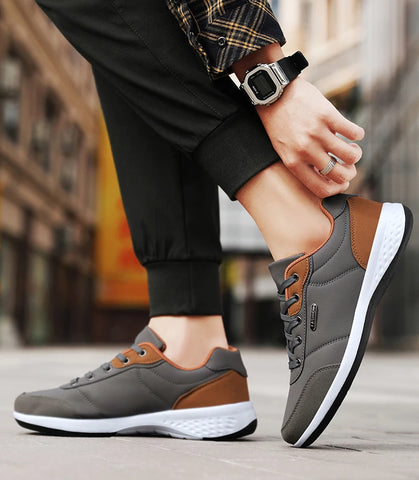 tenis cinza masculino detalhes marrom